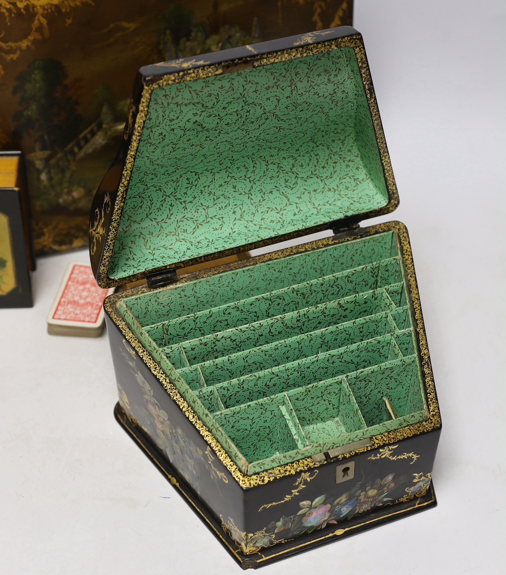 A Victorian papier maché blotter pad, and stationery box and two ebonised treen boxes